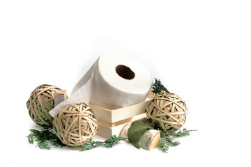 a roll of toilet paper in a small wooden crate isolated on white