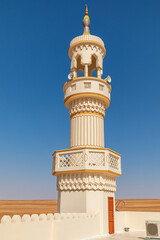 Fototapeta premium The minaret of a mosque in the desert of Oman.