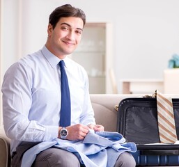 Businessman preparing for the business trip