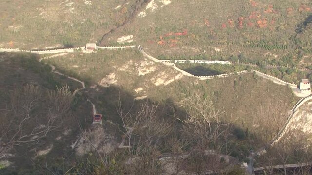 Great Wall of China, Juyong Pass section, train passing in the background.
