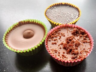 Handcrafted no bake peanut butter cups. Chocolate, freshly ground peanut butter and flavor combinations.