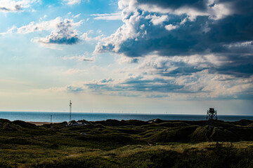 Sand dunes of Blavand beach in Denmark with watch tower