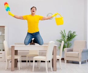 Man husband cleaning the house helping his wife