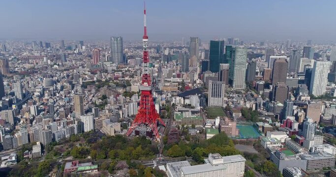 Aerial shot of Tokyo tower and city skyline with downtown buildings, Japan