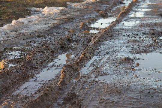 Country dirt road in the spring. Dirt on the road during the thaw.