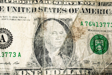 Closeup of an dirty old worn faded US dollar bill