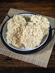 Ranginang or rangginang or rengginang is Indonesian traditional crispy rice or glutinous rice crackers, served in white plate on tray. Kind of deep fried food.