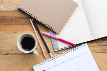 notebook planner ,mobile phone for business work  arrangement flat lay style on background wooden