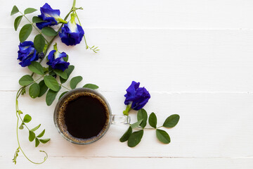 blue flowers butterfly pea local flora of asia with hot coffee arrangement flat lay style on...
