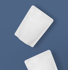 top view of two lying doy pack pouch package for coffee, snack, chips, spice, etc. blank white...