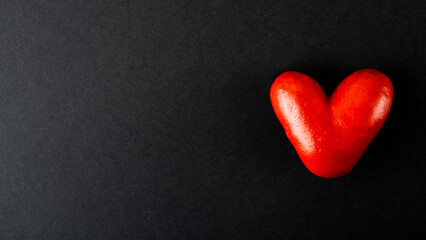 Fototapeta premium Valentine's day concept. Handmade red hearts on a dark background. With place for your text.
