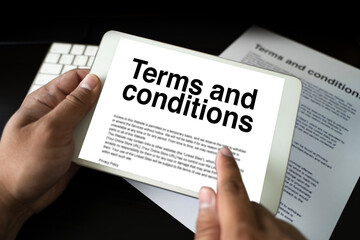 Terms and conditions businessman reviewing  terms and conditions of agreement office terms and conditions