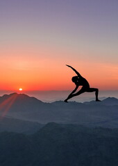 silhouette of a woman yoga pose