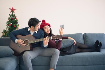 Asian man and woman couple family in casual outfit holiday winter theme live together and playing...
