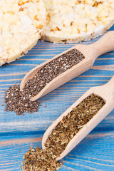 Crunchy rice or corn waffles with chia seeds and oregano, healthy dietary breakfast concept