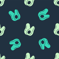 Naklejka premium Green and beige Avocado fruit icon isolated seamless pattern on blue background. Vector.
