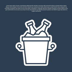 Blue line Beer bottles in ice bucket icon isolated on blue background. Vector.
