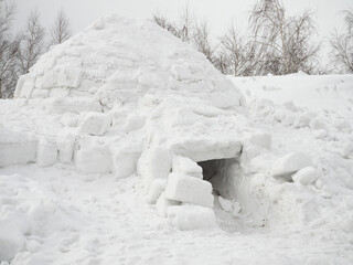 real igloo on the snow, winter cloudy day