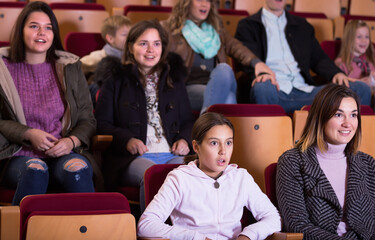 Glad people enjoying film in cold season in cinema