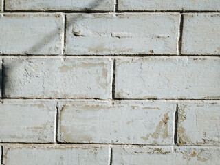 The texture of an old white wall of brick. Vintage, grunge background.