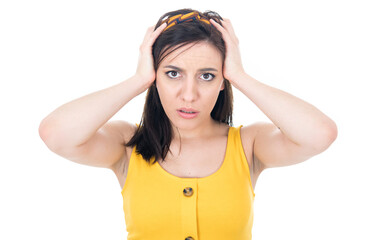Mistake. Worried young woman holding her hands on head, isolated on white background