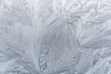 Patterns of Ice on a Frozen Window on a Winter Day