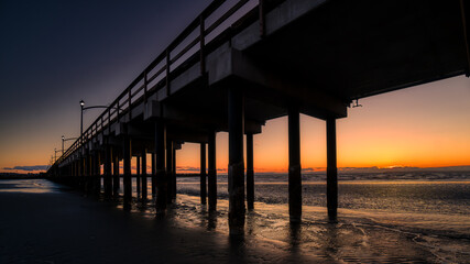 Sun Setting over Canada's Longest Pier in Semiahmoo Bay at the village of White Rock in British Columbia, Canada