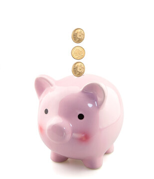 Piggy bank with falling coins