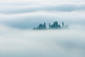 Minimalistic foggy landscape at the morning time. Tuscany, Italy