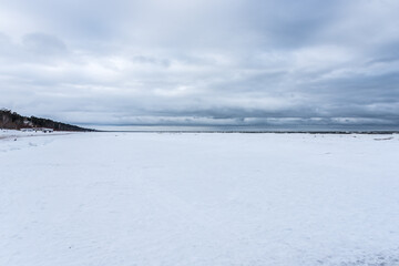 Frozen Baltic Sea Coast in Late Winter on a Cloudy Day