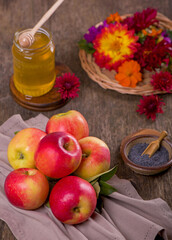 Apple and honey, traditional food of jewish New Year celebration, Rosh Hashana. Selective focus. Copyspace background