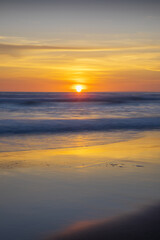 Sunset and beach. Seascape background. Bright sunlight. Sun at horizon line. Scenic view. Sunset golden hour. Sunlight reflection in water. Magnificent scenery. Copy space. Bali