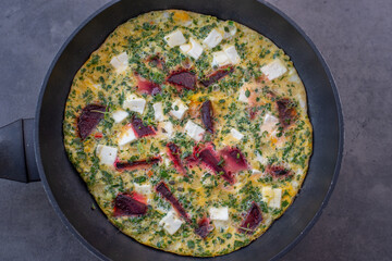 vegetable frittata with beetroot, feta cheese and herbs