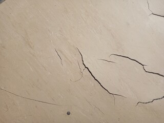 Broken wall texture with old paint. The consequences of the earthquake.