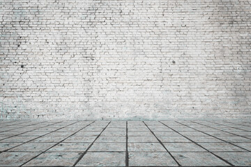Empty room with bricks wall and tiled floor.