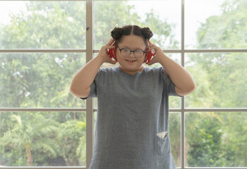 Portrait of Happy Asian young fat dancer girl dancing ballet to exercise, enjoy listening to music. Entertainment leisure fun. People lifestyle at home.