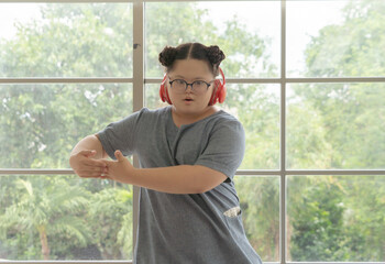 Portrait of Happy Asian young fat dancer girl dancing ballet to exercise, enjoy listening to music. Entertainment leisure fun. People lifestyle at home.
