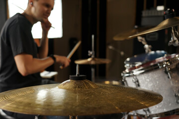 High-hat and crash cymbal close-up in the studio. Drum kit