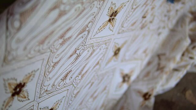 Closeup shot of Indonesian batik pattern detail. Batik fabric being made.