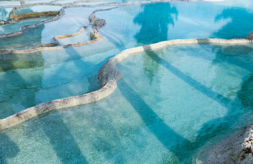 Amazing landscape of Pamukkale thermal springs with cascade of white calcite terraced baths, Turkey