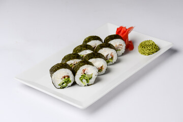 Maki Sushi - Roll made of smoked salmon and cream cheese. Traditional Japanese cuisine concept, over white background.