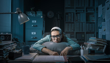 Frustrated office worker leaning on the desk