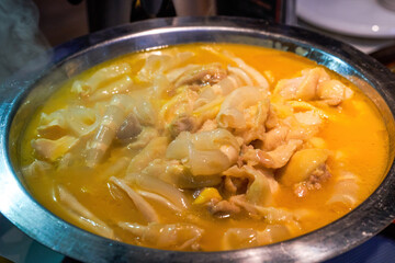 A delicious Chinese Cantonese dish, chicken soup, chicken with flower maw