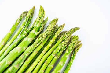 Spring seasonal vegetable asparagus on white background