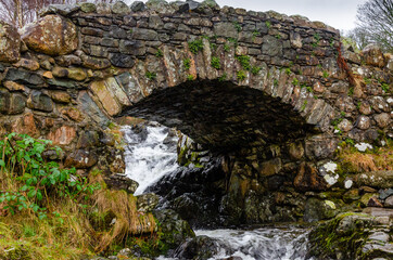 Ashness Stone Bridge over a small river near Keswick Lake District National Park Cumbria England UK