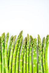 Spring seasonal vegetable asparagus on white background