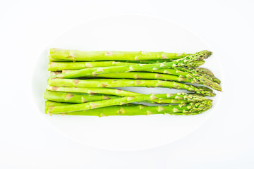 Spring seasonal vegetable asparagus on white background