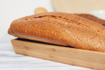 fresh loaf bread bins on the table kitchen food ration 