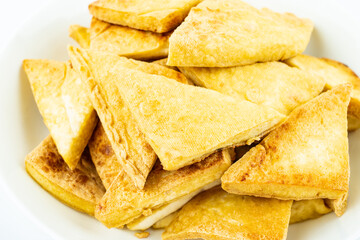 A plate of golden fried dried tofu