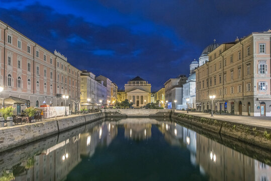 View of the Grand Canal lit up at night, Trieste, Italy.